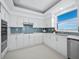Well-lit kitchen with stainless steel appliances at 3010 Grand Bay Blvd # 482, Longboat Key, FL 34228