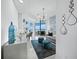 Bright living room featuring water view, modern furniture, and stylish decor at 3010 Grand Bay Blvd # 482, Longboat Key, FL 34228