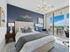 Charming main bedroom with modern decor, a king-size bed, and a balcony with great views at 3010 Grand Bay Blvd # 482, Longboat Key, FL 34228