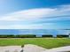 Scenic view of the bay, golf course, and shoreline from a high-rise balcony at 3010 Grand Bay Blvd # 482, Longboat Key, FL 34228