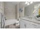 Stylish bathroom showcasing tile accents and a bathtub with shower at 3375 Chestertown Loop, Lakewood Ranch, FL 34211