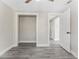 Bedroom boasts gray wood-look flooring, and a large open closet at 3457 50Th N Ave, St Petersburg, FL 33714