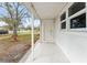 Inviting covered front porch with tile flooring, perfect for relaxing and enjoying the outdoors at 3457 50Th N Ave, St Petersburg, FL 33714