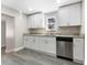 Modern kitchen with granite counters, white cabinets and stainless steel dishwasher at 3457 50Th N Ave, St Petersburg, FL 33714