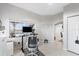 Well-lit home office featuring a window view and space for two desks and a white rolling chair at 3730 Cadbury Cir # 414, Venice, FL 34293