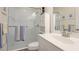 This bathroom features a glass shower, toilet, and vanity with a white sink at 3839 Autumn Fern Ter, Sarasota, FL 34243