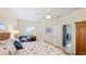 A comfortable bedroom features a nautical-themed bedspread and an adjacent walk-in closet at 3839 Autumn Fern Ter, Sarasota, FL 34243