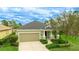Charming single-Gathering home with attached garage, well-manicured lawn, and mature landscaping at 3839 Autumn Fern Ter, Sarasota, FL 34243