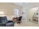This office features a desk and chair, an arm chair, and a large window at 3839 Autumn Fern Ter, Sarasota, FL 34243