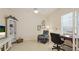 A tidy office space features an executive chair, desk, and ample natural lighting at 3839 Autumn Fern Ter, Sarasota, FL 34243