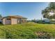 Picturesque backyard featuring a well-maintained lawn and scenic pond views, perfect for outdoor enjoyment at 4414 Turnberry Ct, Bradenton, FL 34210