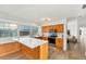 Bright kitchen with spacious island, modern appliances, and seamless flooring, offering both style and functionality at 4414 Turnberry Ct, Bradenton, FL 34210