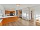 Open kitchen with light countertops, wood cabinets, and stainless appliances, creating a clean and functional cooking space at 4414 Turnberry Ct, Bradenton, FL 34210