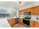 Well-lit kitchen with stainless steel appliances, stylish countertops, and ample cabinet space for modern cooking needs at 4414 Turnberry Ct, Bradenton, FL 34210