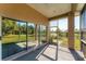 Enjoy this screened-in lanai that offers serene views of the lush yard and a tranquil pond at 4414 Turnberry Ct, Bradenton, FL 34210