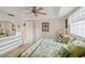 This bedroom features two twin beds, neutral carpet and bright, white walls at 534 Warwick Ln, Venice, FL 34293