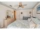 This bedroom with a crib features a ceiling fan and plenty of storage at 534 Warwick Ln, Venice, FL 34293