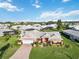 A charming single-story home with a well-manicured lawn and vibrant landscaping at 534 Warwick Ln, Venice, FL 34293