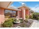 Inviting home featuring a charming fountain feature and well-maintained landscaping at 534 Warwick Ln, Venice, FL 34293