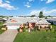 Charming single-story home featuring well-kept lawn, garden and driveway, bathed in sunshine at 534 Warwick Ln, Venice, FL 34293