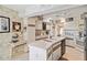 Bright kitchen featuring white cabinetry, modern appliances, and a large island with dual sink at 534 Warwick Ln, Venice, FL 34293