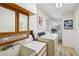 Well-lit laundry room with a sink, overhead cabinet, and modern washer and dryer at 534 Warwick Ln, Venice, FL 34293