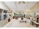 Spacious living room featuring plush carpeting, neutral tones, and plenty of natural light at 534 Warwick Ln, Venice, FL 34293