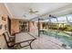 Spacious outdoor patio area with a swimming pool, ideal for entertaining or relaxing at 534 Warwick Ln, Venice, FL 34293