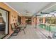 Outdoor patio area featuring a swimming pool, and ample seating, perfect for relaxation and entertainment at 534 Warwick Ln, Venice, FL 34293
