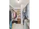 A functional walk-in closet with ample shelving and hanging space for organized storage at 534 Warwick Ln, Venice, FL 34293