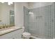 Modern bathroom featuring an accent wall in the shower and a glass shower door at 552 Bocelli Dr, North Venice, FL 34275