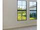 Bedroom with a view of a tree and a landscaped yard at 552 Bocelli Dr, North Venice, FL 34275