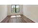 Bright bedroom with hardwood floors and a large window at 552 Bocelli Dr, North Venice, FL 34275