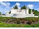 Community sign entrance of Aria surrounded by lush landscaping at 552 Bocelli Dr, North Venice, FL 34275