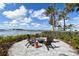 Community fire pit featuring comfortable seating, perfect for enjoying scenic lake views and socializing at 552 Bocelli Dr, North Venice, FL 34275