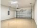 Spacious two car garage featuring epoxy flooring, garage door opener and electrical panel at 552 Bocelli Dr, North Venice, FL 34275
