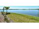 Beautiful lake view featuring tropical landscaping along the shoreline at 552 Bocelli Dr, North Venice, FL 34275