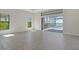 Spacious living room with tile flooring and view of screened-in pool area at 552 Bocelli Dr, North Venice, FL 34275