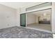 Covered patio with brick flooring and sliding glass doors leads to an open floor plan with a kitchen at 552 Bocelli Dr, North Venice, FL 34275