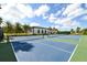 Well-maintained community tennis courts with blue and green surfaces, perfect for sports enthusiasts and recreation at 552 Bocelli Dr, North Venice, FL 34275