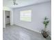 Bedroom featuring tile flooring, closet, ceiling fan and natural light at 5708 Garden Lakes Fern, Bradenton, FL 34203