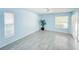 Bright bedroom featuring tile flooring, ceiling fan, natural light, and two windows at 5708 Garden Lakes Fern, Bradenton, FL 34203