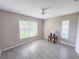 Bedroom featuring tile flooring, two windows and a ceiling fan at 5708 Garden Lakes Fern, Bradenton, FL 34203