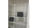 Wire shelving in closet with two gray storage bins at 5708 Garden Lakes Fern, Bradenton, FL 34203