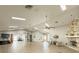 Spacious clubhouse features a stone fireplace, ceiling fans, and plenty of room for activities at 5708 Garden Lakes Fern, Bradenton, FL 34203