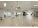 Spacious community room with vaulted ceilings, ceiling fans, a kitchen, and a gathering area with comfortable seating at 5708 Garden Lakes Fern, Bradenton, FL 34203