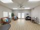 Comfortable community room with cozy seating, a piano, plenty of natural light, and neutral paint colors at 5708 Garden Lakes Fern, Bradenton, FL 34203
