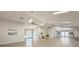 Large common area featuring a stone fireplace, vaulted ceilings, skylights, and a variety of seating options at 5708 Garden Lakes Fern, Bradenton, FL 34203
