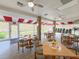 Bright dining area with large windows, ceiling fans and comfortable seating for residents at 5708 Garden Lakes Fern, Bradenton, FL 34203