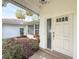 Welcoming front entrance with a decorative door and manicured landscaping at 5708 Garden Lakes Fern, Bradenton, FL 34203